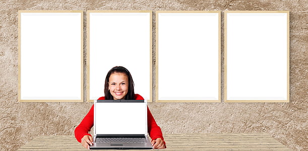woman showing turned-on laptop computer thumbnail