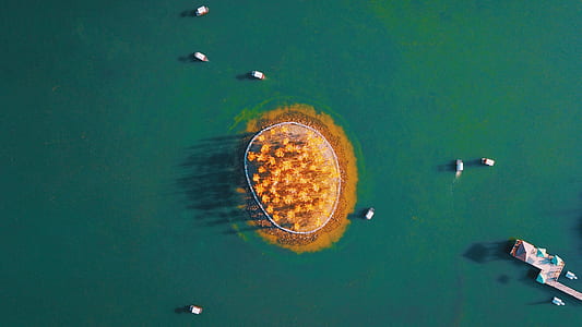 aerial view of brown island during daytime thumbnail