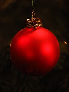 red Christmas bauble with black background thumbnail