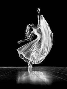 woman in white gown while dancing thumbnail