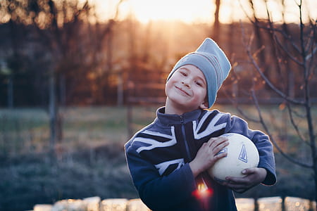boy holding ball thumbnail