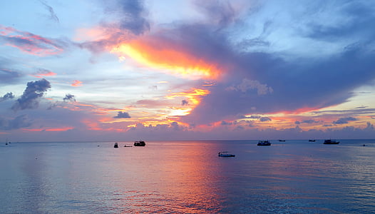 calm body of water under white sky thumbnail