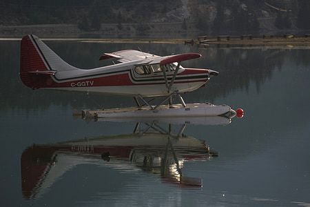 white and red airplane during daytime thumbnail