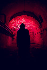 silhouette of person standing inside tunnel thumbnail
