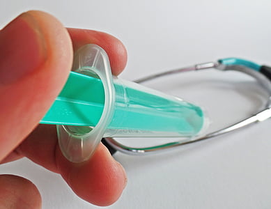 person holding blue and white syringe thumbnail