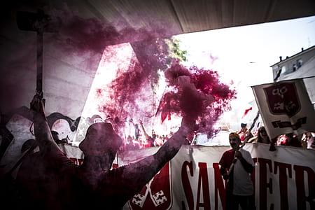 silhouette of man with pink smoke on him thumbnail