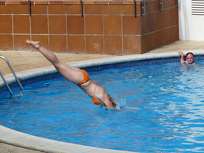 woman diving in pool thumbnail