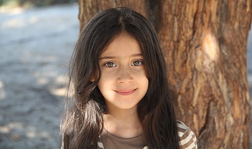 girl wears brown and white striped shirt thumbnail