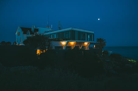 white concrete house at nighttime thumbnail