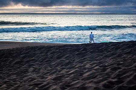 man standing at seashore thumbnail