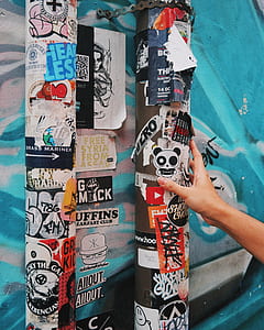 person holding stickers thumbnail