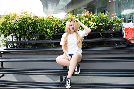 woman wearing white shirt and blue short shorts thumbnail