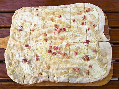 pizza crust on brown chopping board thumbnail