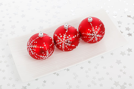 three red baubles on top of white tray thumbnail