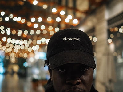 man wearing black fitted cap thumbnail