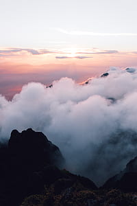 white clouds on black mountains thumbnail