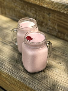 two clear glass jars on gray surface thumbnail