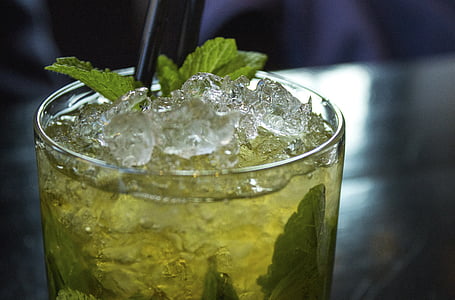 clear drinking glass with green liquid and ice thumbnail