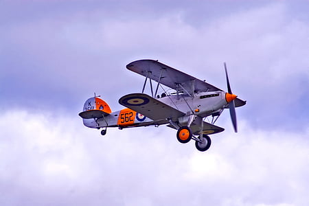 white and orange plane on air during daytime thumbnail
