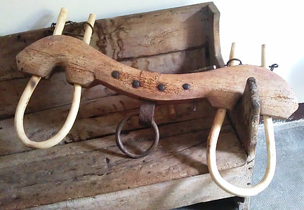 brown wooden yolk on bench thumbnail