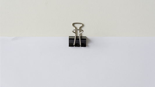 black binder clip with printer paper thumbnail