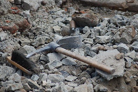 gray pick-ax on gray stone thumbnail