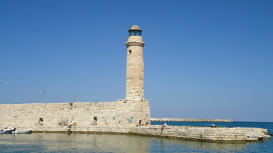 lighthouse under clear blue sky thumbnail