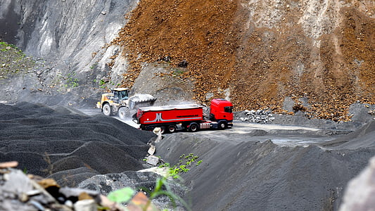 red ruck near yellow front loader thumbnail