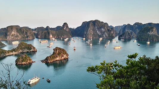 white boats on body of water near islands thumbnail