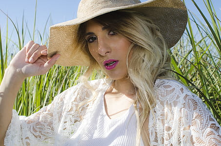 Blonde Hair Woman Wearing Brown Hat thumbnail
