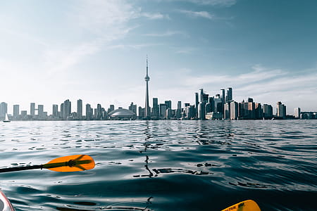 Paddling By City Skyline Photo thumbnail