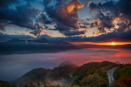 mountain range view with pavement during golden time thumbnail