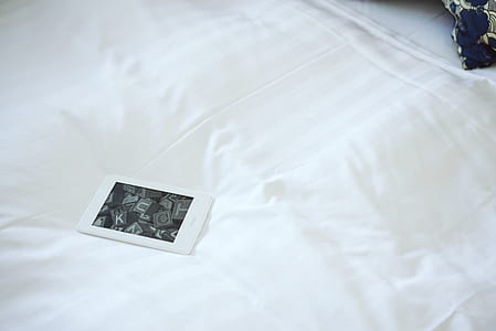 Amazon Kindle on bed thumbnail