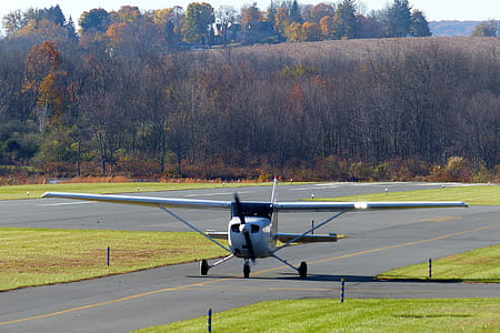 A Cessna single engine private airplane on the tarmac waiting for takeoff. thumbnail