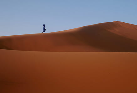 person walking on desert thumbnail