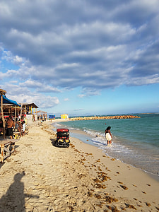 Beach and Shacks by the ocean under the skies in Kingston, Jamaica thumbnail