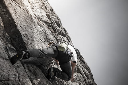 man wall climbing during daytime thumbnail