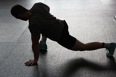 man stretching on floor thumbnail