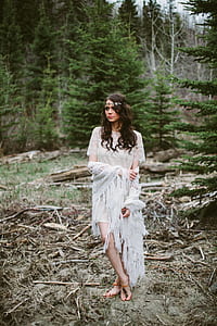 women's white knit short-sleeved dress standing near tree thumbnail