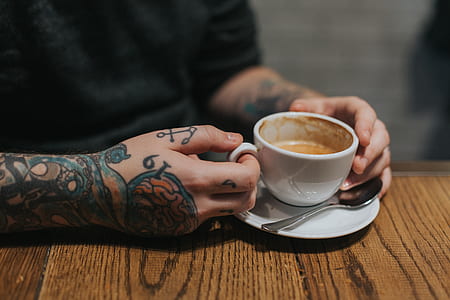 person holding ceramic mug thumbnail