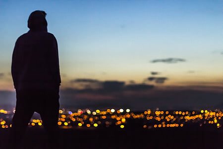 silhouette of man watching lights thumbnail