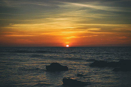 photo of golden hour and sea waves thumbnail