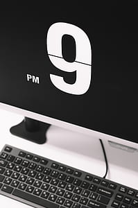 silver flat screen computer monitor displaying 9 PM thumbnail