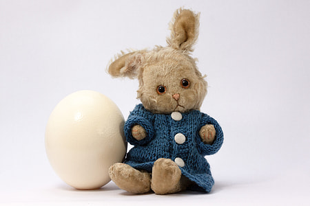brown rabbit plush toy beside white egg thumbnail