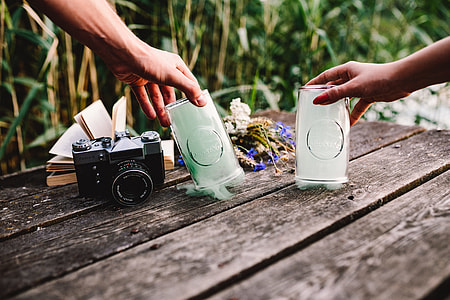 Colorful smoke bomb, book and vintage camera thumbnail