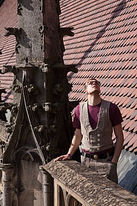 man standing near roof thumbnail