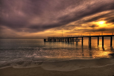 brown wood dock during sunset thumbnail