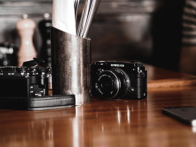 two cameras on table thumbnail