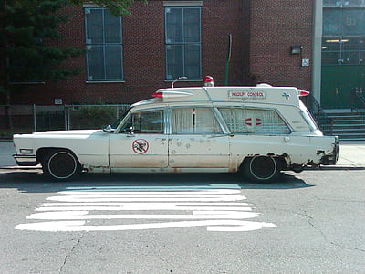 white station wagon on gray surface thumbnail