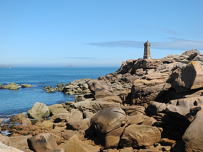lighthouse on top of rock formation thumbnail